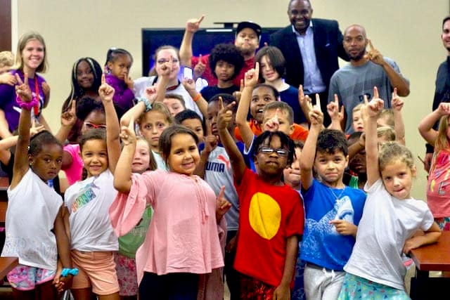 Anti-bullying school assembly with Jamahl Keyes demonstrating an inclusion exercise with middle school students 